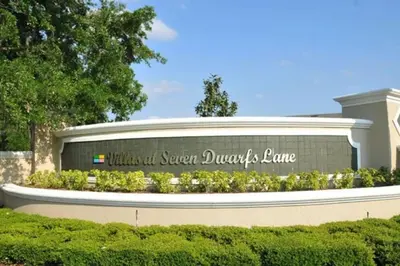 a sign for the school of sugar duchesne at 4 Bedroom 3 Bathroom Villas At Seven Dwarfs 24-102 in Kissimmee