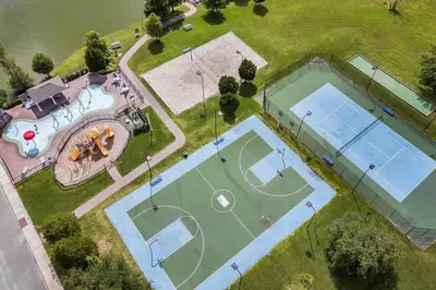an overhead view of two tennis courts on a field at 4 Bedroom 3 Bathroom Villas At Seven Dwarfs 24-102 in Kissimmee