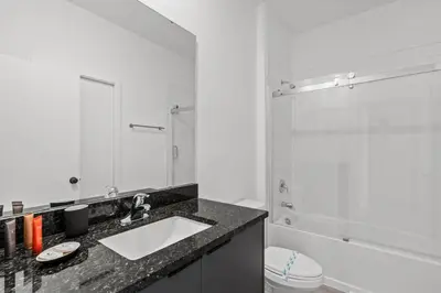 a bathroom with a sink and a shower and a toilet at 3 Bedroom 3 Bathroom The Hub At Westside Reserve 3300 TT in Kissimmee