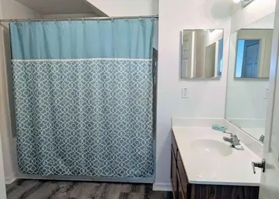 a bathroom with a shower and a sink at 4 Bedroom 3 Bathroom Villas At Seven Dwarfs 8-108 in Kissimmee