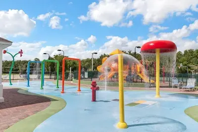 a water park with a fountain with a fire hydrant at 4 Bedroom 3 Bathroom Villas At Seven Dwarfs 8-108 in Kissimmee