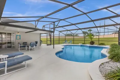 a patio with a swimming pool with a pergola at 4 Bedroom Value Plus Home with Private PooI in Orlando