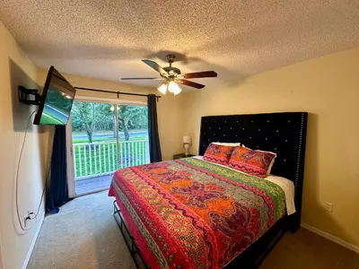 a bedroom with a bed and a ceiling fan at Grand Emerald 3BR Condo Resort near Disney Parks in Kissimmee
