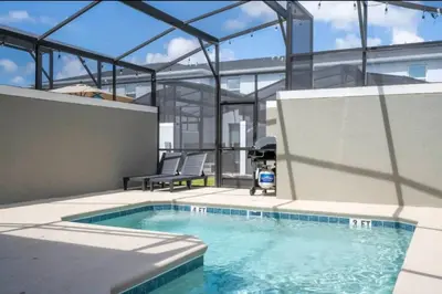 a swimming pool in the middle of a building at Condominium villas near Disney Orlando Florida in Kissimmee