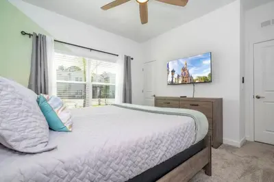 a bedroom with a large bed and a window at Condominium villas near Disney Orlando Florida in Kissimmee