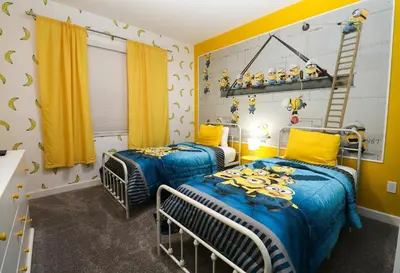 two twin beds in a room with yellow curtains at Themed 5BD Home Movie and Game Room 4726 in Kissimmee