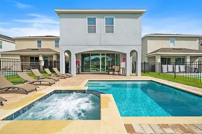 a swimming pool in front of a house at 7410 Marker Avenue in Orlando
