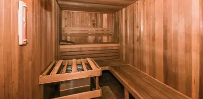a small wooden sauna with a bench in it at 161 - 4 bed Gem at Terraverde Resort in Kissimmee