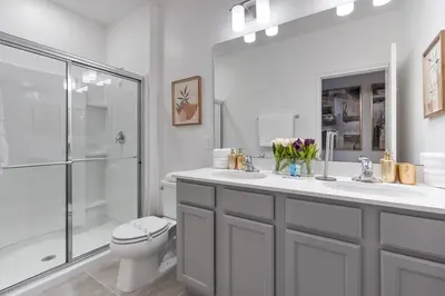 a bathroom with a toilet and a sink and a shower at Brand NEW 12Bedrooms12Bathroom At Paradiso Grande in Orlando