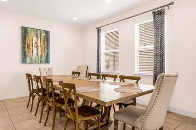 a dining room with a table and chairs at Your Dream Vacation Awaits Family 10-Bd Villa in Orlando