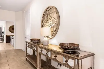 a living room with a table with bowls on it at Your Dream Vacation Awaits Family 10-Bd Villa in Orlando