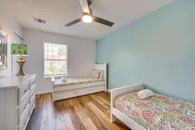 a bedroom with two beds and a window at Private Pool Family-Friendly Kissimmee Townhome! in Kissimmee