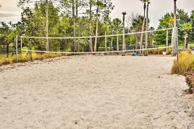 an empty volleyball court with a volleyball net at Private Pool Family-Friendly Kissimmee Townhome! in Kissimmee