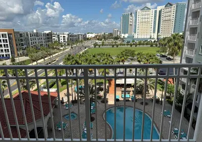 a view of the city from the balcony of a resort at The Point Hotel Apartment 603 Near to Universal in Orlando