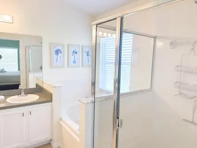 a bathroom with a shower and a sink at EP1051SEL - Private Vacation Pool Home Near Disney in Kissimmee