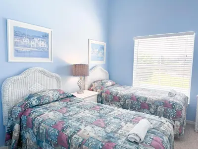 a bedroom with two beds and a window at EP1051SEL - Private Vacation Pool Home Near Disney in Kissimmee