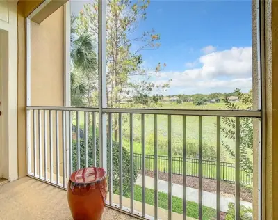 a view from a balcony with a drink at WH7660-205CS - Lakeview on the hills in Orlando