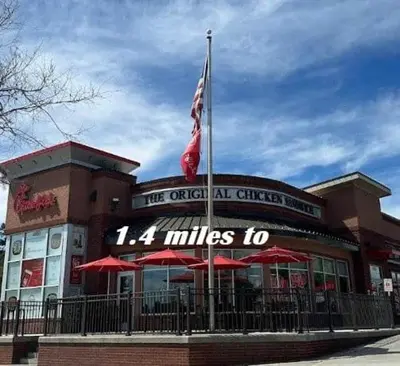 a restaurant with an american flag in front of it at 4 Bedroom villa in Lake Berkley, Private Pool Fantastic View, Free WiFi, Theme Parks All Around! in Kissimmee