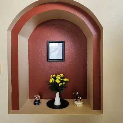 a vase with yellow flowers on a shelf in a room at 4 Bedroom villa in Lake Berkley, Private Pool Fantastic View, Free WiFi, Theme Parks All Around! in Kissimmee