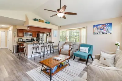 a living room with a couch and a table at Dream Condo in Kissimmee