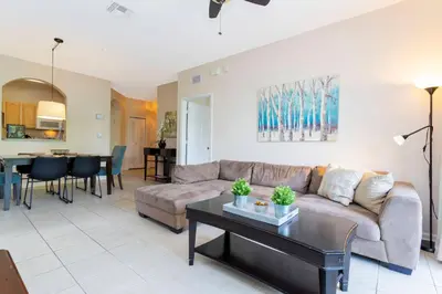 a living room with a couch and a table at Cozy Apartment 3BD2BA at Windsor Hills WH28131 in Orlando