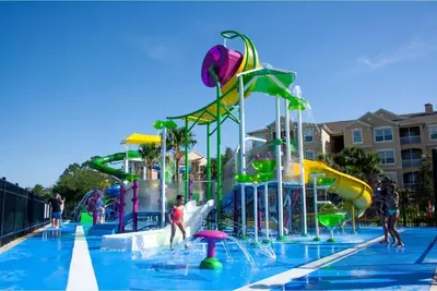 a pool with a water park with a water slide at Cozy 3BR2BA Condo at Windsor Hills Resort WH76604 in Orlando