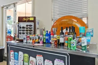 a counter top with bottles of alcohol on it at Windsor Hills Magic,Resort Waterslides,Pool,Disney in Orlando