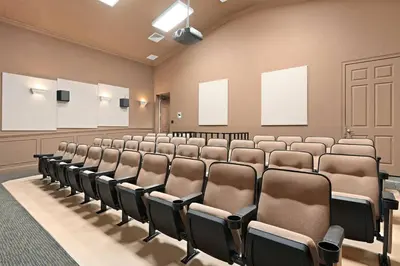 an empty lecture room with rows of chairs at Windsor Hills Magic,Resort Waterslides,Pool,Disney in Orlando