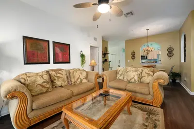a living room with two couches and a coffee table at Budget Friendly Condo in Windsor Hills Resort w garden view in Orlando