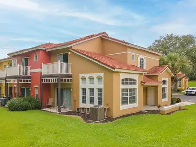 a house with a green lawn in front of it at New Listing Just remodeled 4 BR - ER2739 in Kissimmee