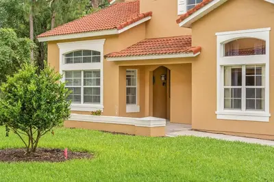 a house with a green lawn in front of it at New Listing Just remodeled 4 BR - ER2739 in Kissimmee