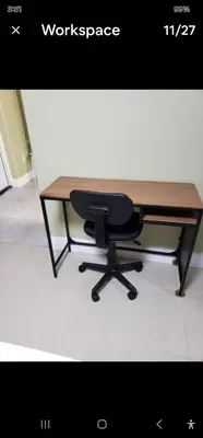 a desk with a chair sitting next to a desk at Pretige Studio in Orlando