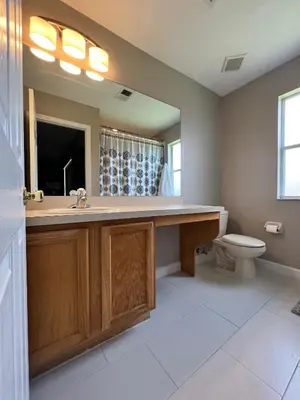 a bathroom with a sink and a toilet at Camaro in Orlando