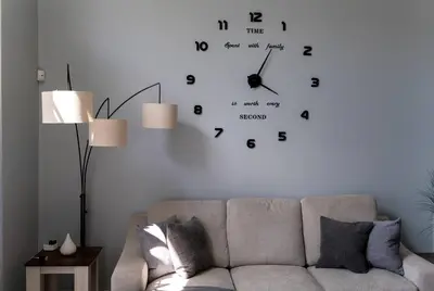 a living room with a couch and a clock on the wall at Disney World Vacation Home in Orlando