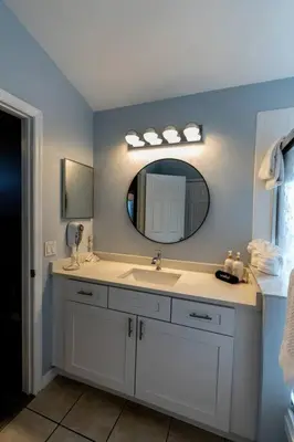 a bathroom with a sink and a mirror at Disney World Vacation Home in Orlando
