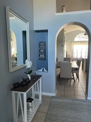 a living room with a table and a dining room at Disney World Vacation Home in Orlando