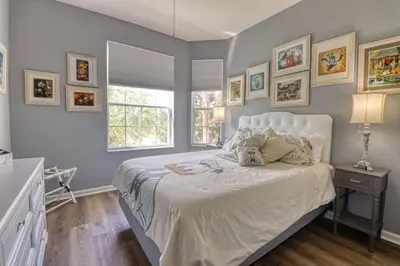 a bedroom with a large bed and a window at Amazing Condo in Windsor Hills Close to Disney in Orlando