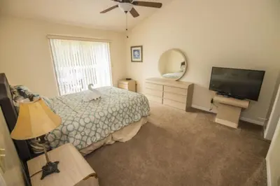 a bedroom with a bed and a flat screen tv at CM3 SW030-2F in Kissimmee