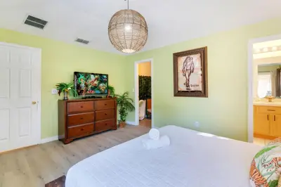 a bedroom with a bed and a television in it at VR Jungle 2 Jungle with Disney's Tarzan and MORE in Kissimmee