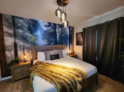 a bedroom with a large bed with a large painting on the wall at Tropical Getaway with Xbox & PS5 Gaming Paradise in Kissimmee
