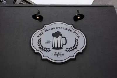 a sign for the margarita challenge app on a wall at Studio Close to Universal Intl Drive in Orlando