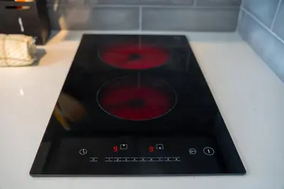 a stove top with red apples on top of it at Studio Close to Universal Intl Drive in Orlando