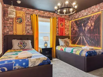 a bedroom with two beds and a brick wall at 4327 Create Memories in a Magical 5BD Home in Kissimmee