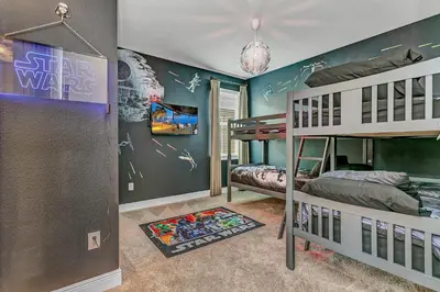 a bedroom with two bunk beds in a room at Fairytale Retreat in Orlando