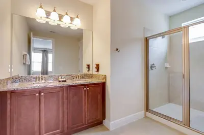 a bathroom with a double sink and a shower at Fairytale Retreat in Orlando