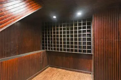 an empty room with a wall of glass blocks at LUXURY 6000 sqft Mansion in Downtown Orlando Sleeps 12 in Orlando