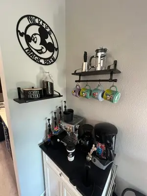 a kitchen with a black counter top and shelves at DisneyShuttleKing & Queen Be 5 minutes to Disney in Orlando