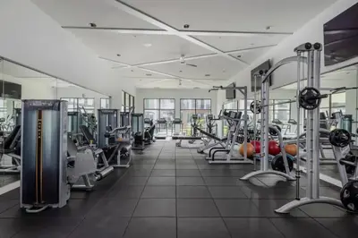 a gym with lots of treadmills and machines at The Edge at Millenia in Orlando
