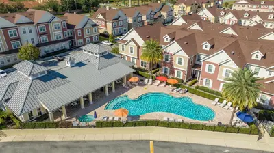 an aerial view of a swimming pool in a residential neighborhood at 5-Suite Disney Escape: Minutes from the Magic in Orlando