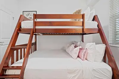 a bunk bed with two pillows on it at 3191 Paradox Circle 202 in Kissimmee